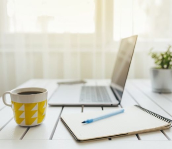 laptop and mug and notepad